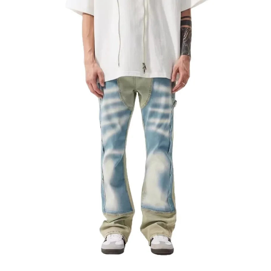 Retro yellow and blue patchwork jeans with splash-ink damaged design on polyester denim fabric