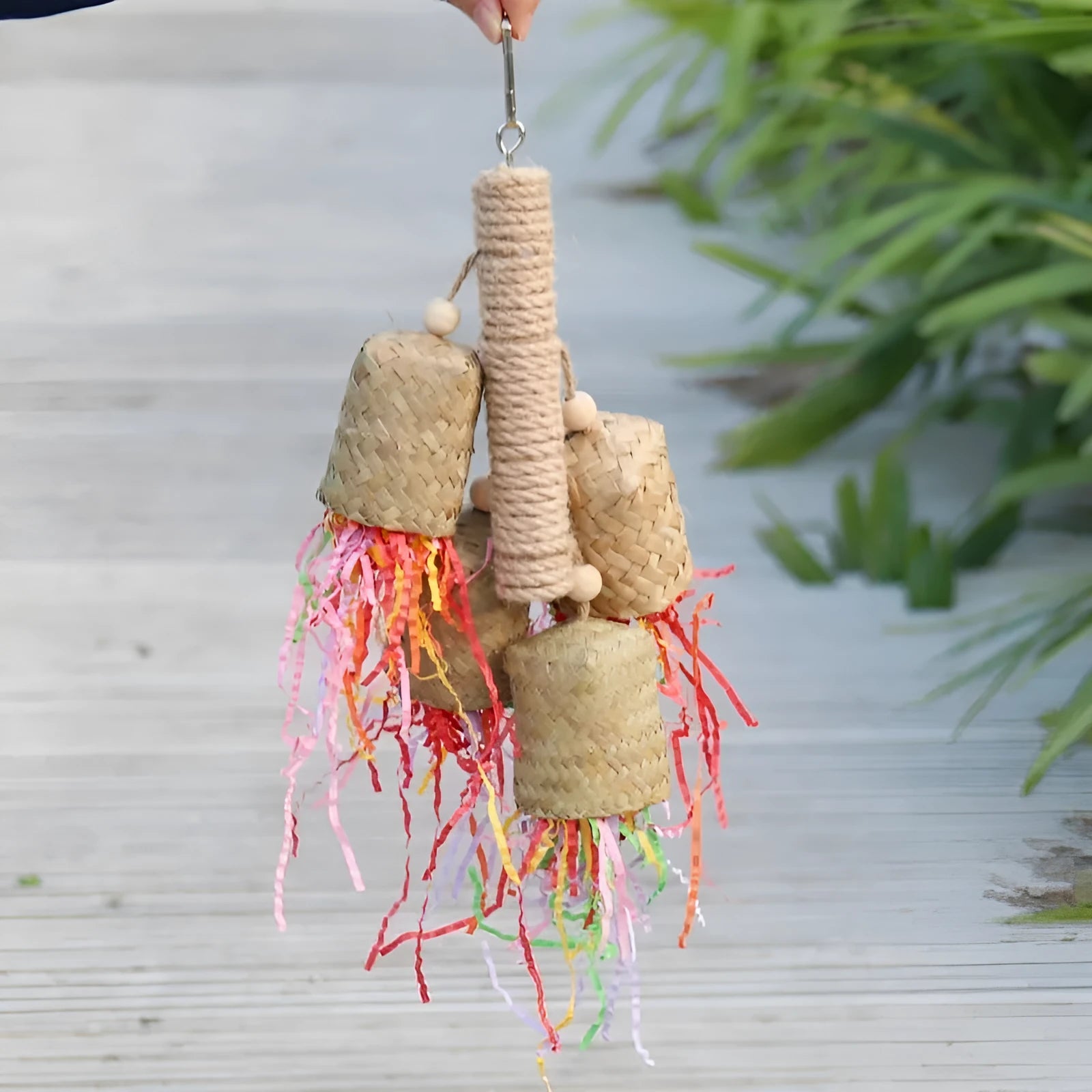 Wooden frame parrot toy with sisal rope and colourful shredded paper strips measuring 15cm by 35cm