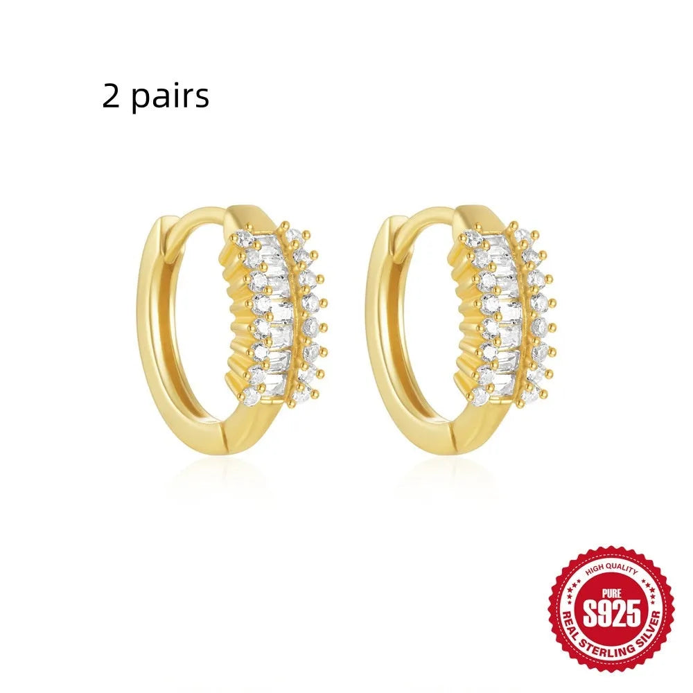 Sterling silver geometric stud earrings with small round designs in gold or silver electroplated finishes