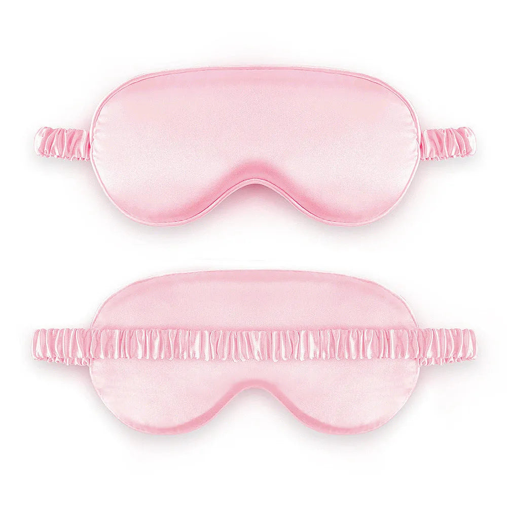 Reversible silk-like sleep eyeshade shown in multiple colour options including sky blue, wine red, and black.