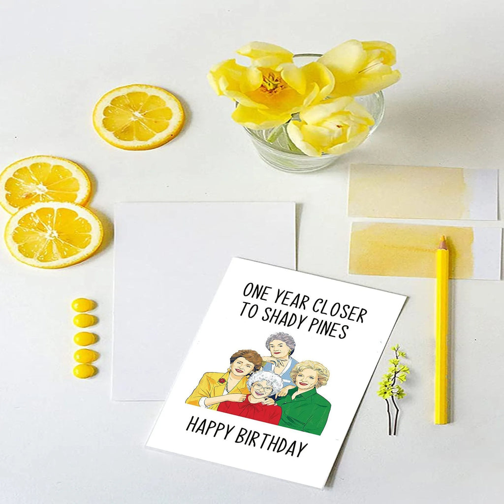 Simple printed paper birthday greeting card with a selection of coloured and kraft paper envelopes.