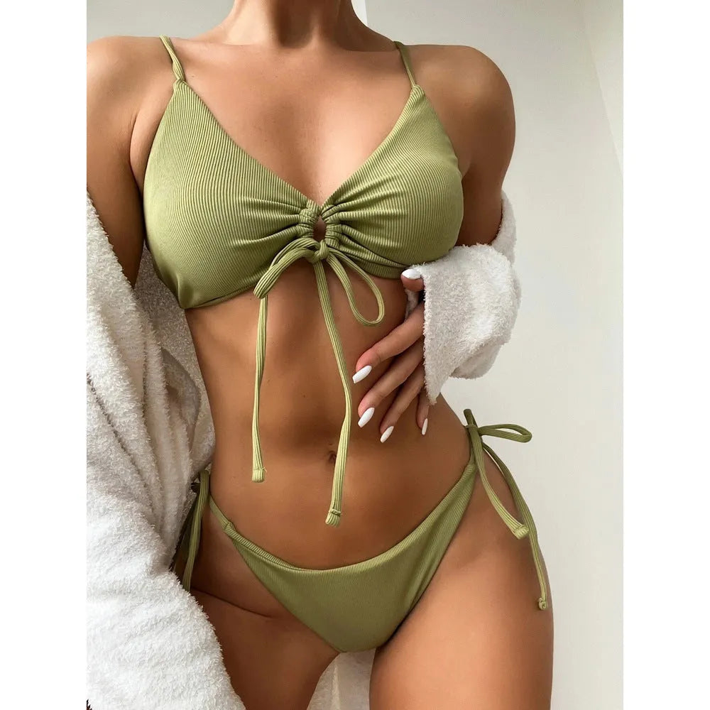 Women's solid colour drawstring bikini set in quick-drying nylon fabric.