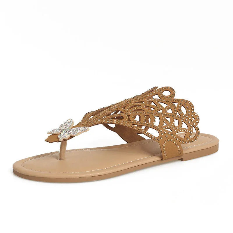 Women's black rhinestone flip-toe sandals with slip-on design and flat rubber sole