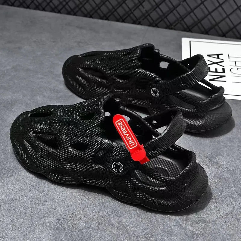 Men's grey coconut slippers with closed toe design and EVA construction on wooden deck