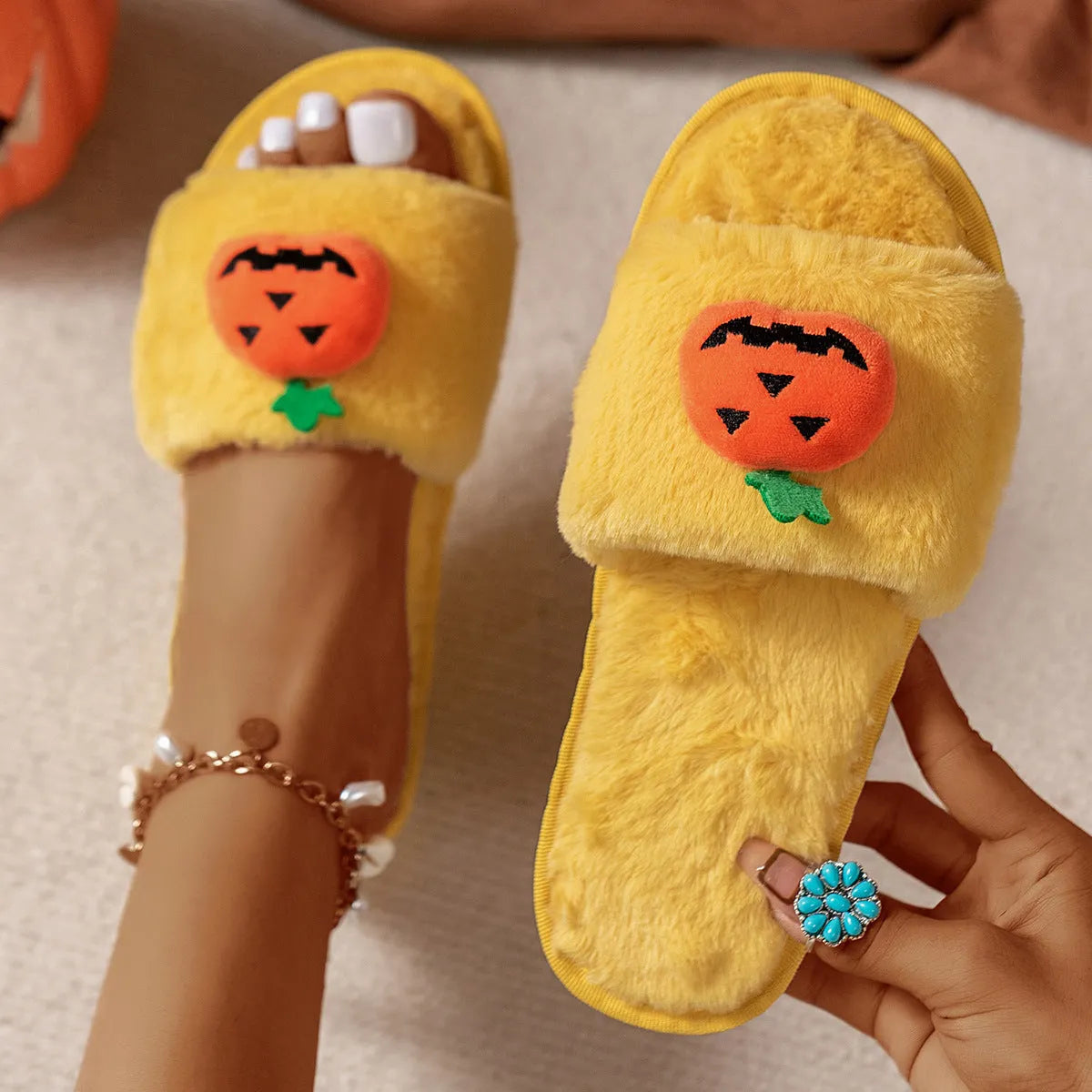 Pumpkin-themed plush slippers with synthetic fur upper and anti-slip PVC sole