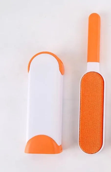 Blue reusable pet hair removal brush with self-cleaning base for sofas and upholstery.
