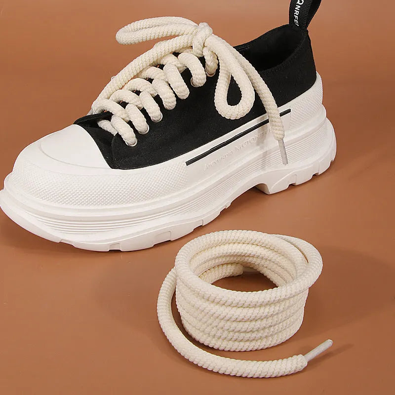 Pair of round woven shoelaces in white next to a ruler showing 10mm diameter and length scale.