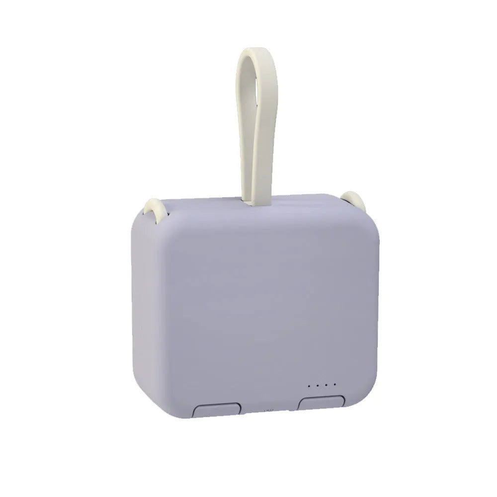 Handbag back clip power bank in blue showing USB-A and Type-C ports and integrated phone stand function.