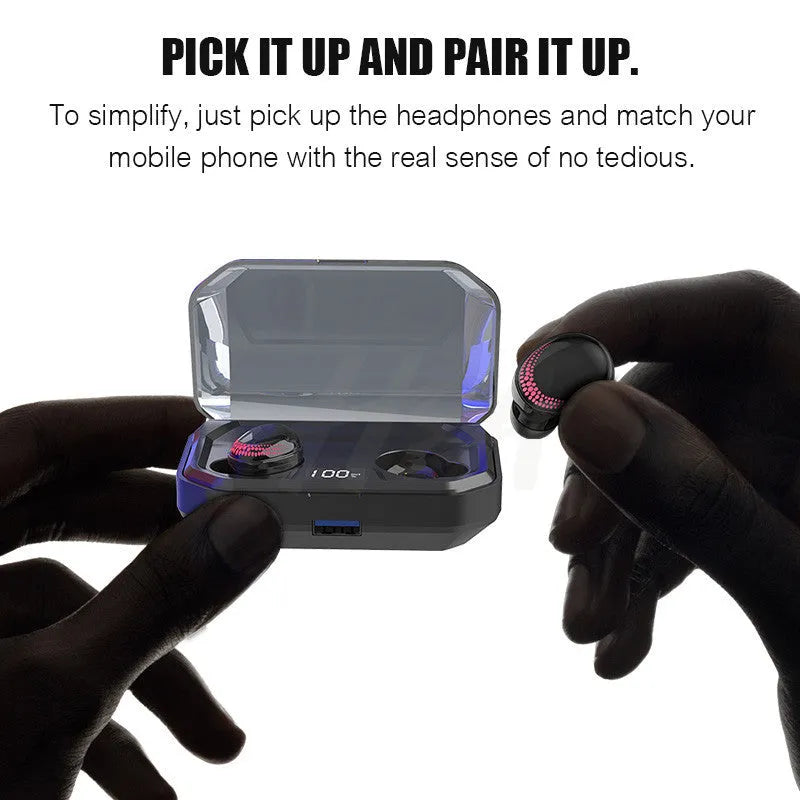 Black wireless Bluetooth headset with charging case on a table.