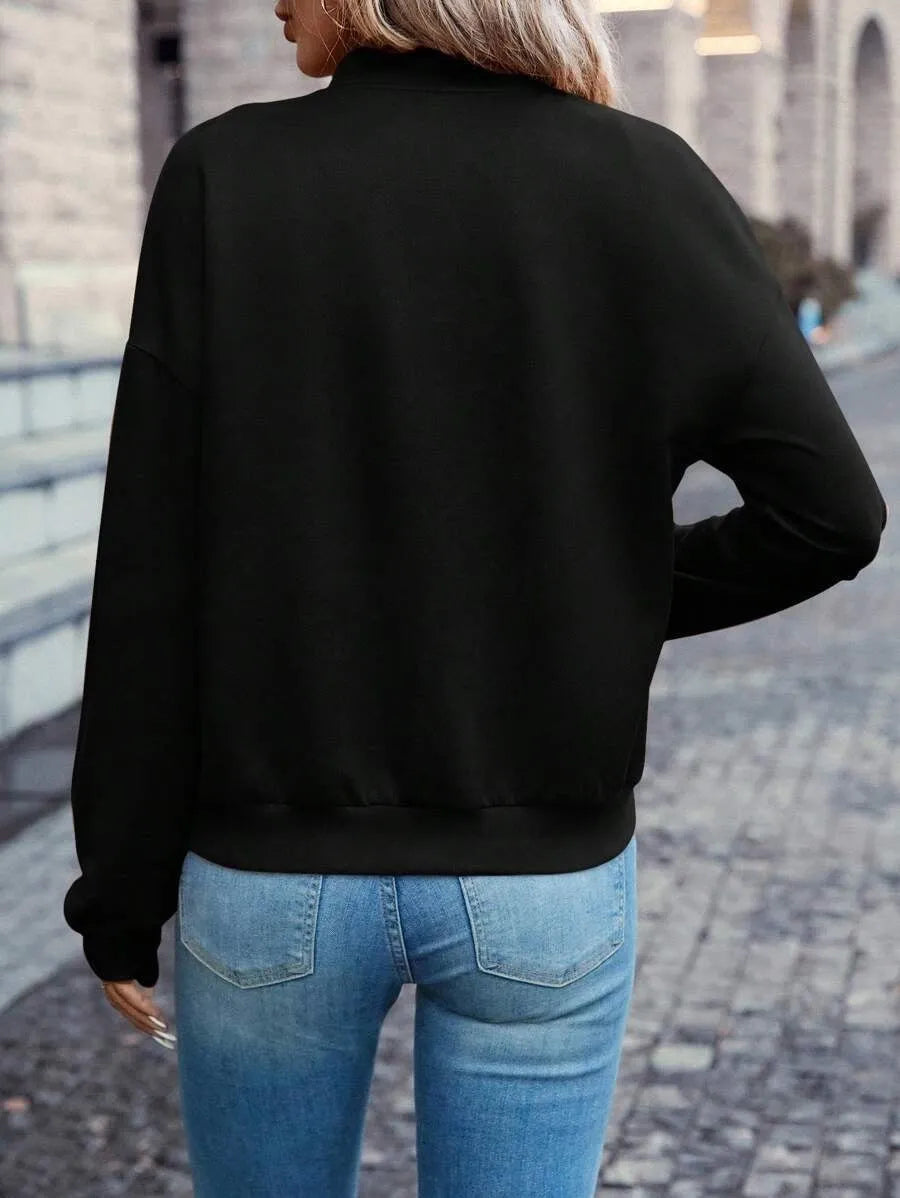 Women's black casual zip jacket with long sleeves and faux pocket detail