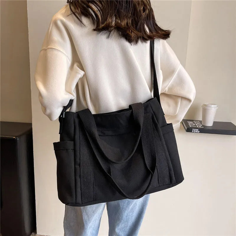 Women's canvas-style polyester shoulder bag with sandwich pocket and phone compartment in solid colour
