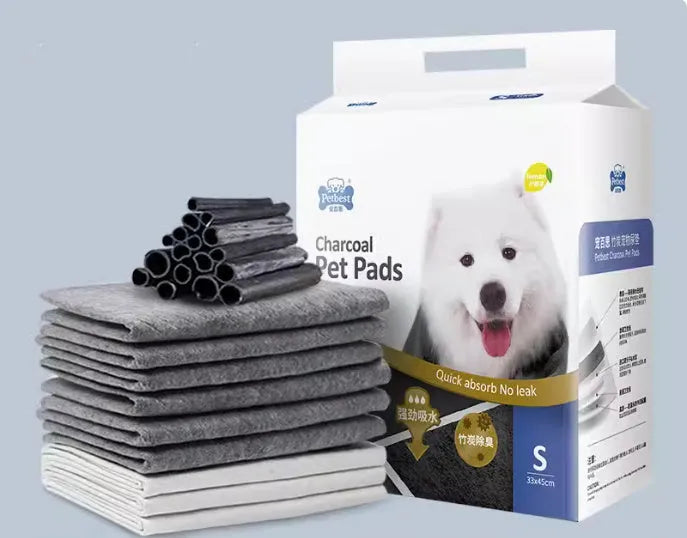 Thickened dog urine training pads showing adhesive backing and bamboo charcoal variety in multiple sizes