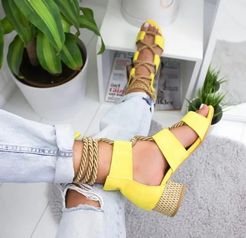 Women's beige suede fashion sandals with ankle strap and fish mouth toe on a rubber sole.