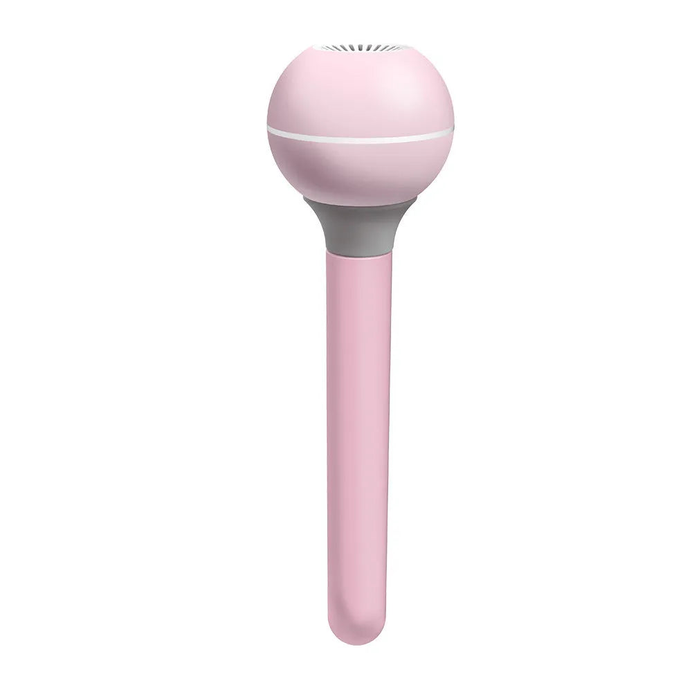 Pink and white Magic Wand portable USB humidifier with columnar design on a table.
