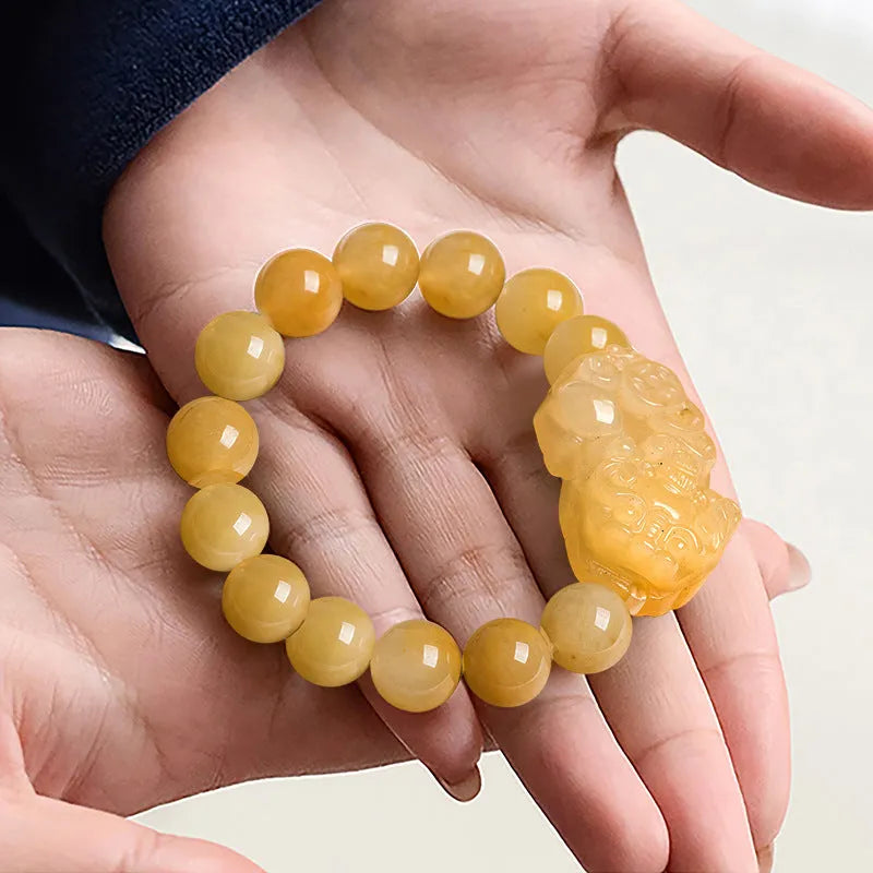 Hand-carved Jinsi Jade money bracelet showing golden thread patterns, displayed in large and small size options.