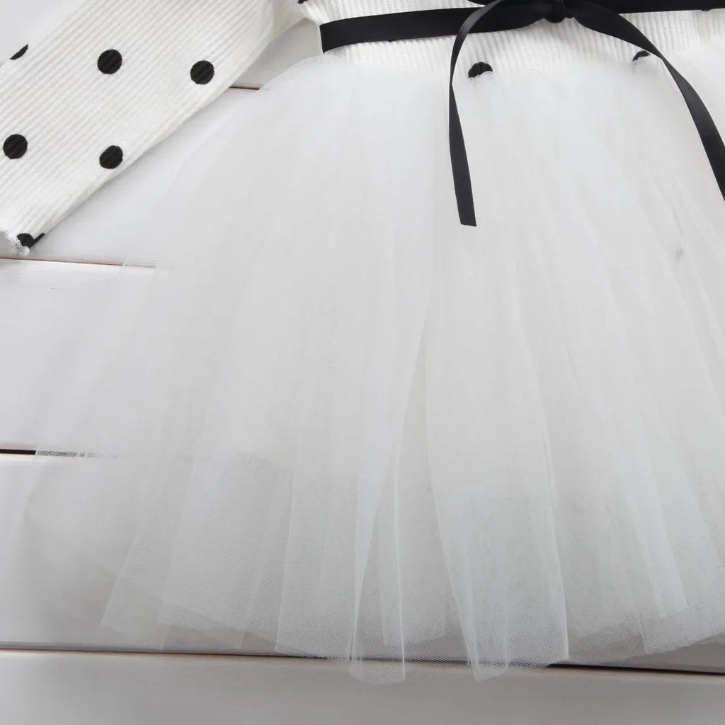 Baby girl wearing black lace tutu dress with long sleeves for birthday party