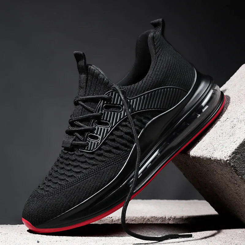 Men's black low-top mesh running sneakers with lace-up front and platform sole
