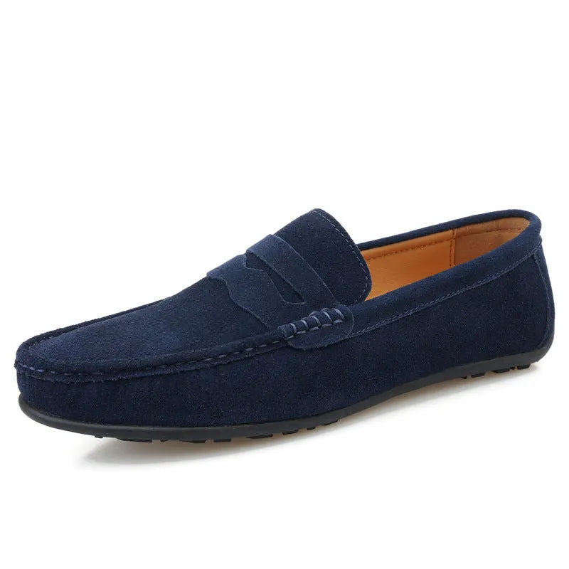 Men's suede slip-on loafers in a solid colour with a round toe and flat rubber sole.
