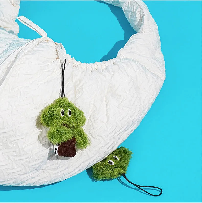 Pine tree shaped cat toy stick with an attached mint-scented bag pendant on a string.