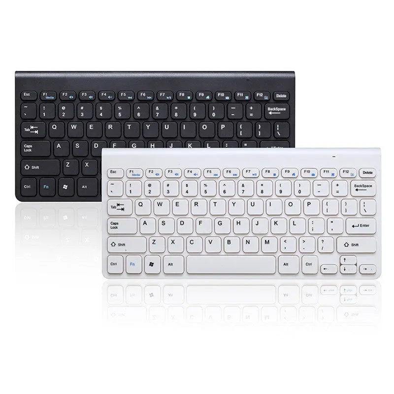 Black and white wireless keyboard and mouse set with USB receiver on a desk.