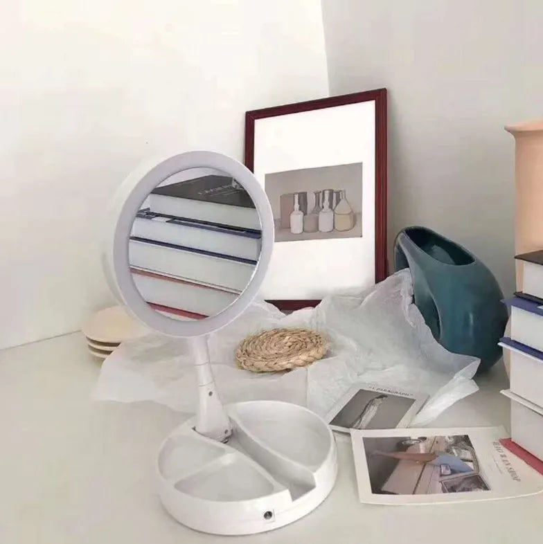 White acrylic frame vanity mirror with LED lights, USB charging port, and foldable design showing storage compartments