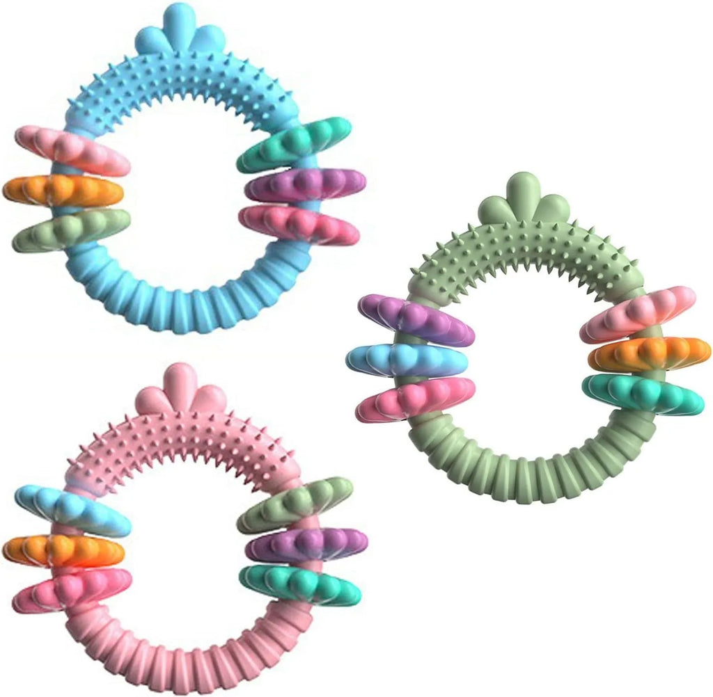 Blue green pink TPR rubber molar stick dog chew toy for small dogs on a white background