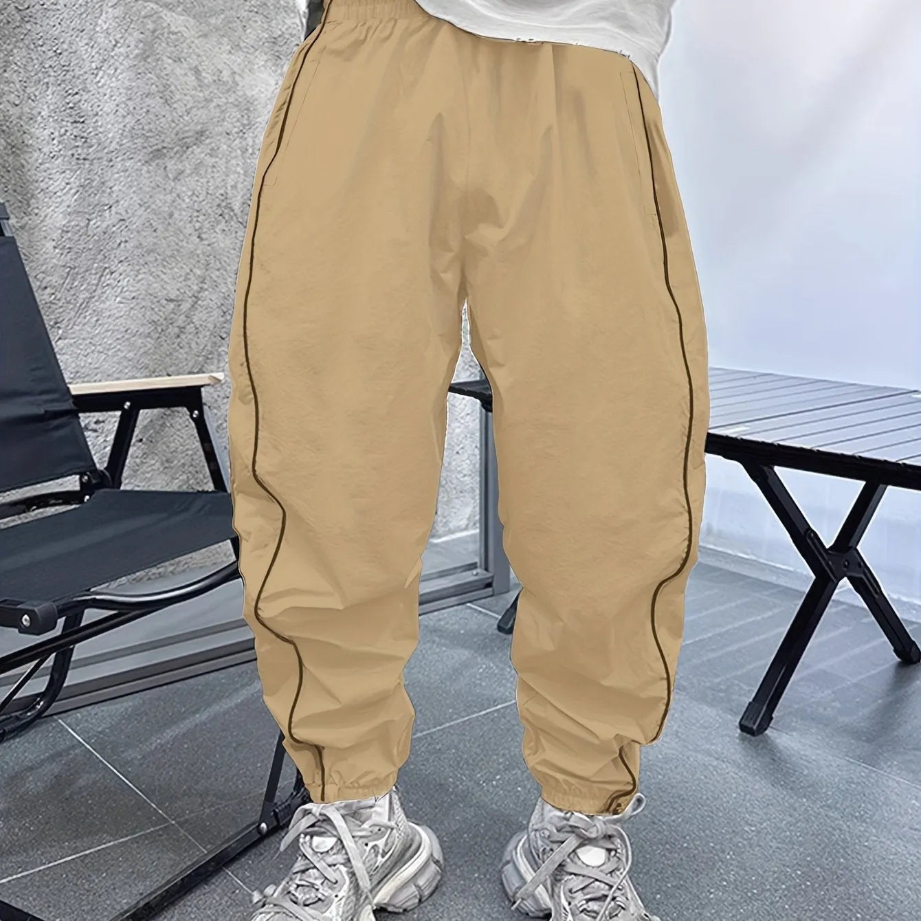 Men's loose-fit cropped casual trousers in bamboo fabric, shown in Army Green colour.