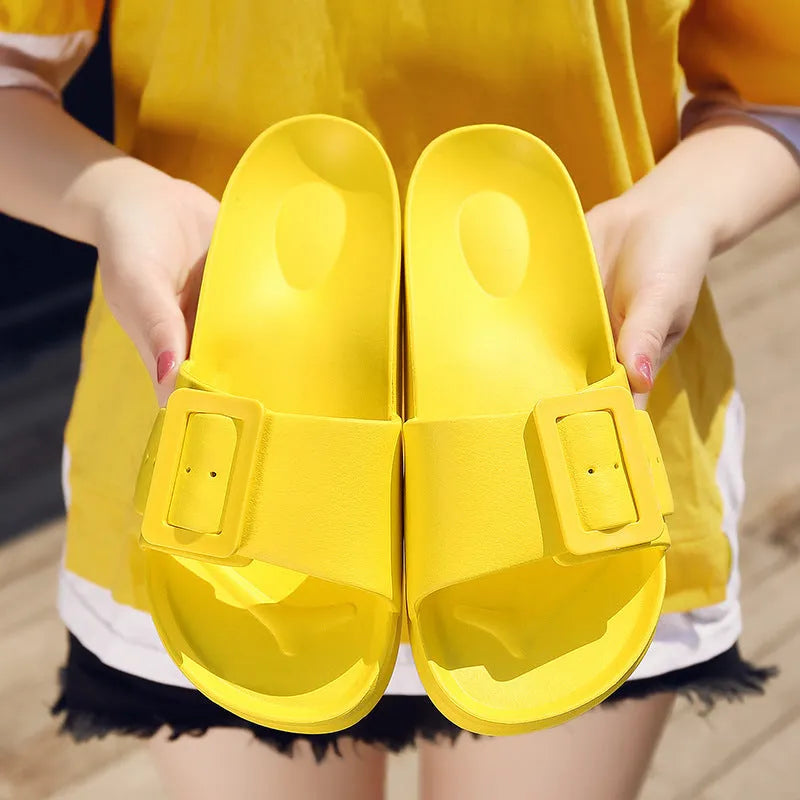Women's grey blue flip flop slippers with a buckle strap and soft EVA sole.