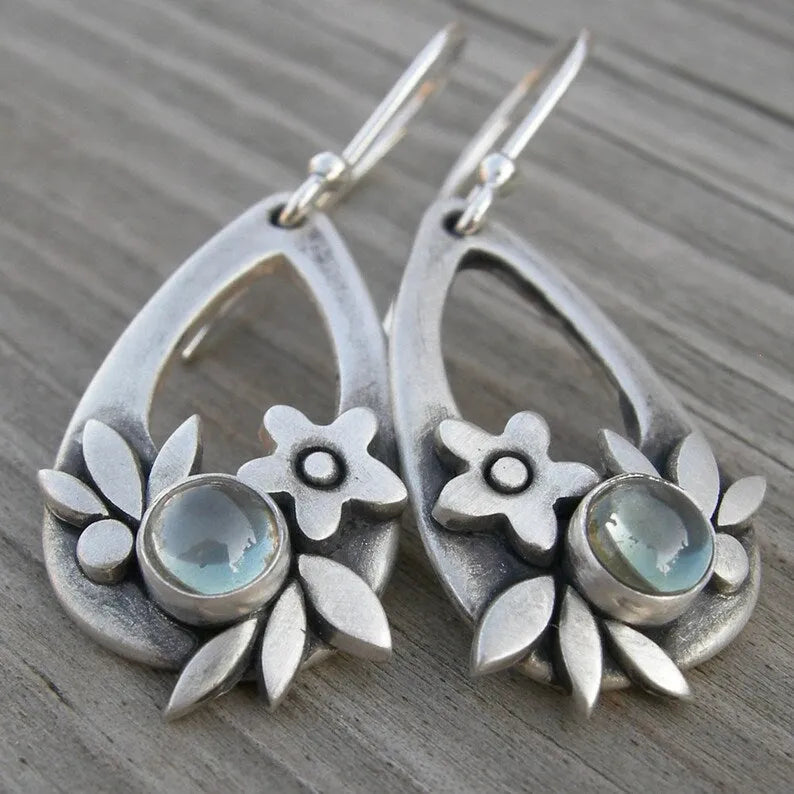 Silver alloy drop earrings with teardrop floral and leaf design