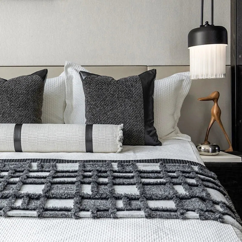 Modern minimalist bed runner nap blanket set with grey and white plaid pattern on bed