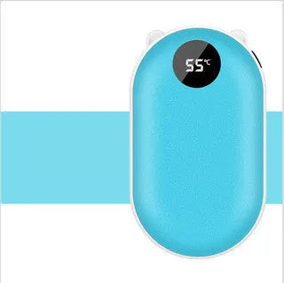 Compact rose gold USB rechargeable hand warmer and power bank with digital display on a wooden table.