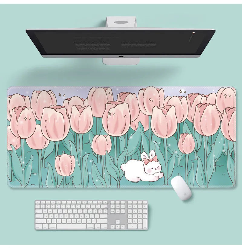 Large flower pattern mouse pad on a desk with keyboard, showing non-slip rubber base and colourful tulip design.