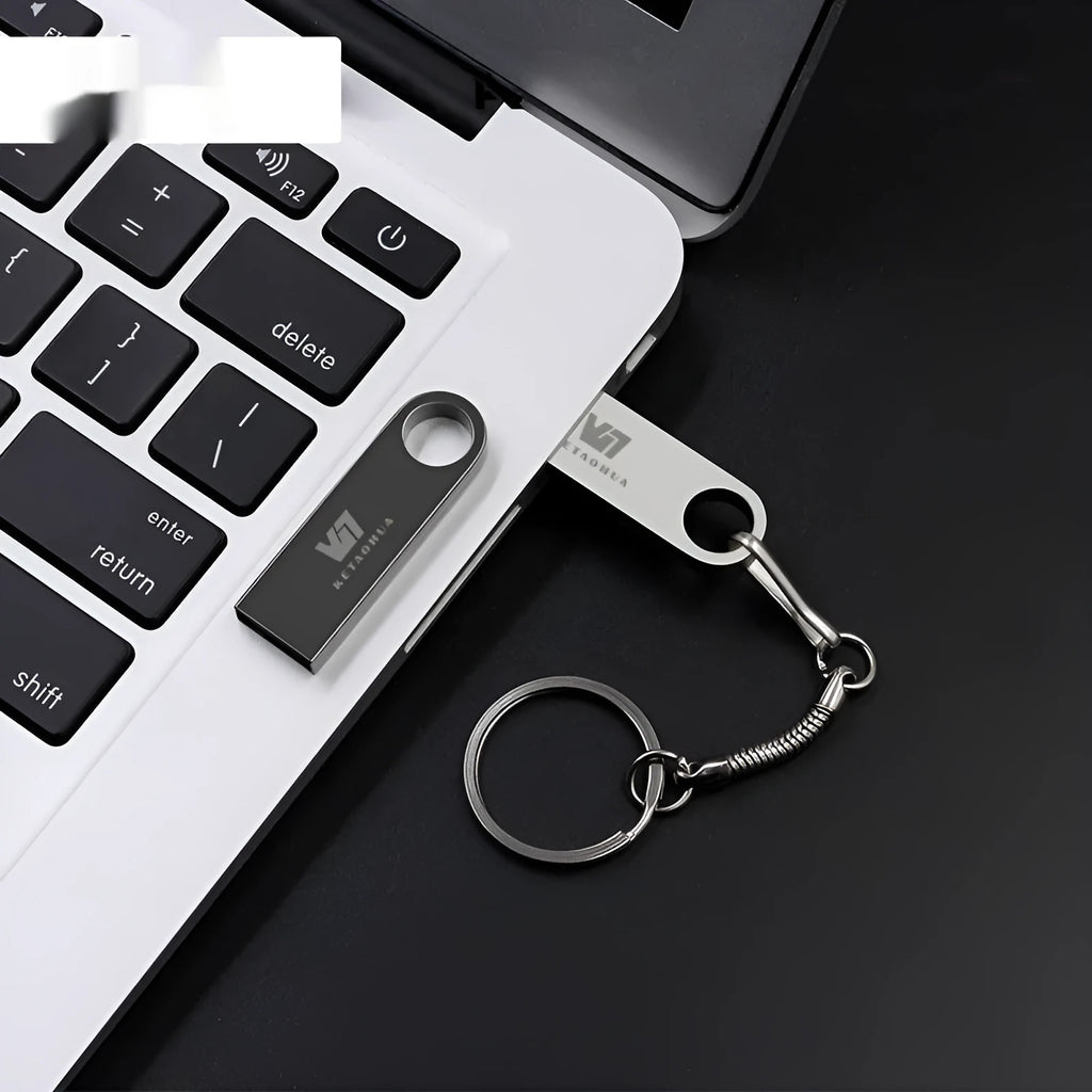 Metal car-shaped USB flash drive in silver finish showing automotive design details