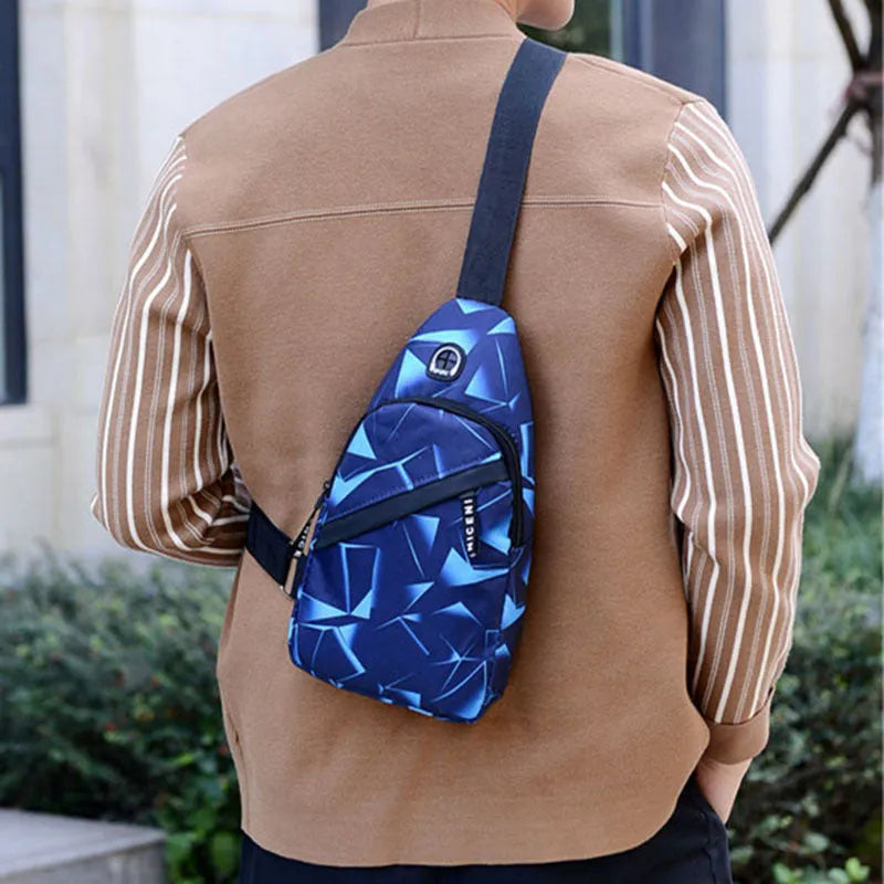 Blue print sling chest bag with a crossbody strap, showing the earphone hole and zipper opening.