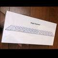 Apple G6 ultra-thin aluminium Bluetooth wireless keyboard in white, showing multimedia function keys.