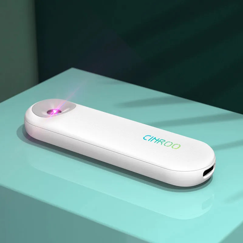White portable UV sterilizer lamp for disinfecting mobile phones and small items.