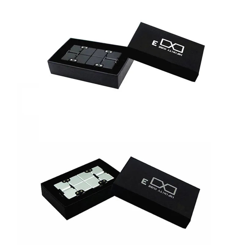 Silver zinc alloy infinity cube fidget toy with rotating segments shown on a flat surface