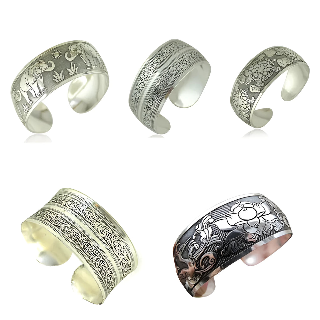 Silver Miao ethnic carved open bracelet with elephant motif on alloy metal