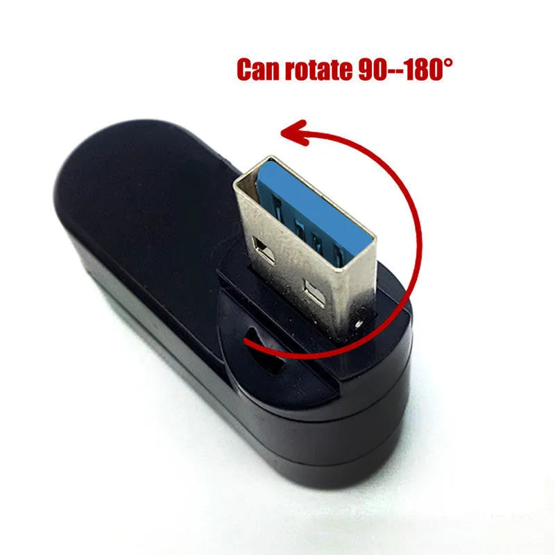 Black or white USB rotary splitter hub with four USB 3.0 ports on a desk.