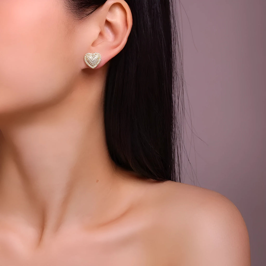 Golden S925 silver heart-shaped stud earrings with moissanite stones