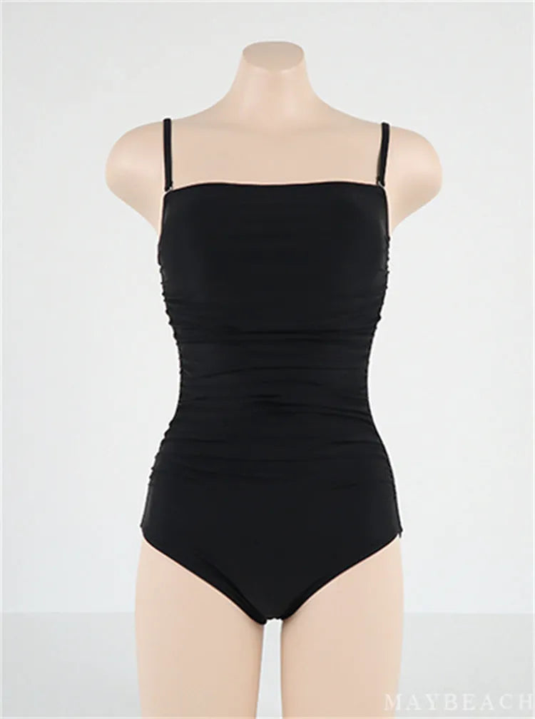 Sling style belly pleated one-piece swimsuit in blue, white, yellow, or black colours