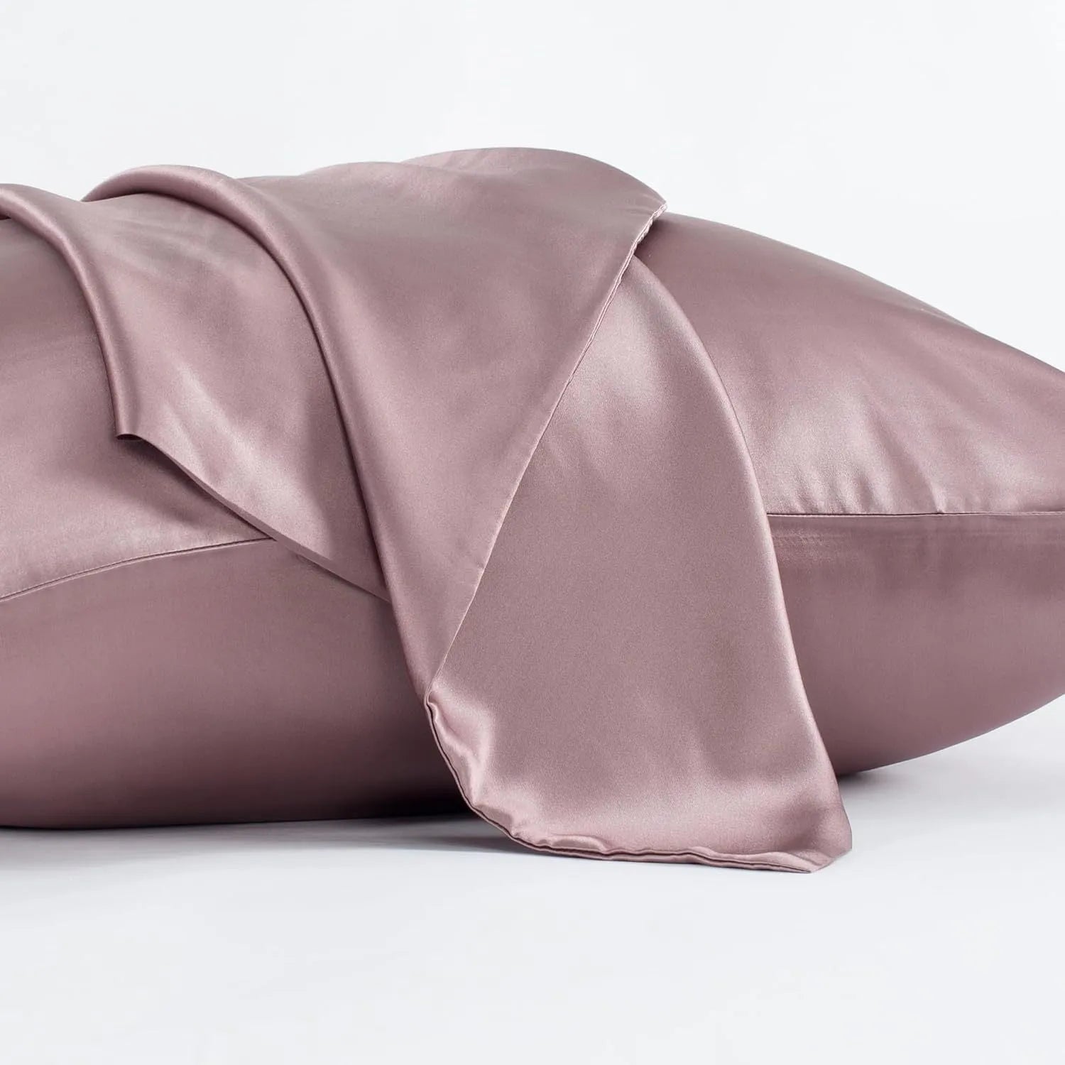 Dark gray envelope closure silk pillowcase on a bed