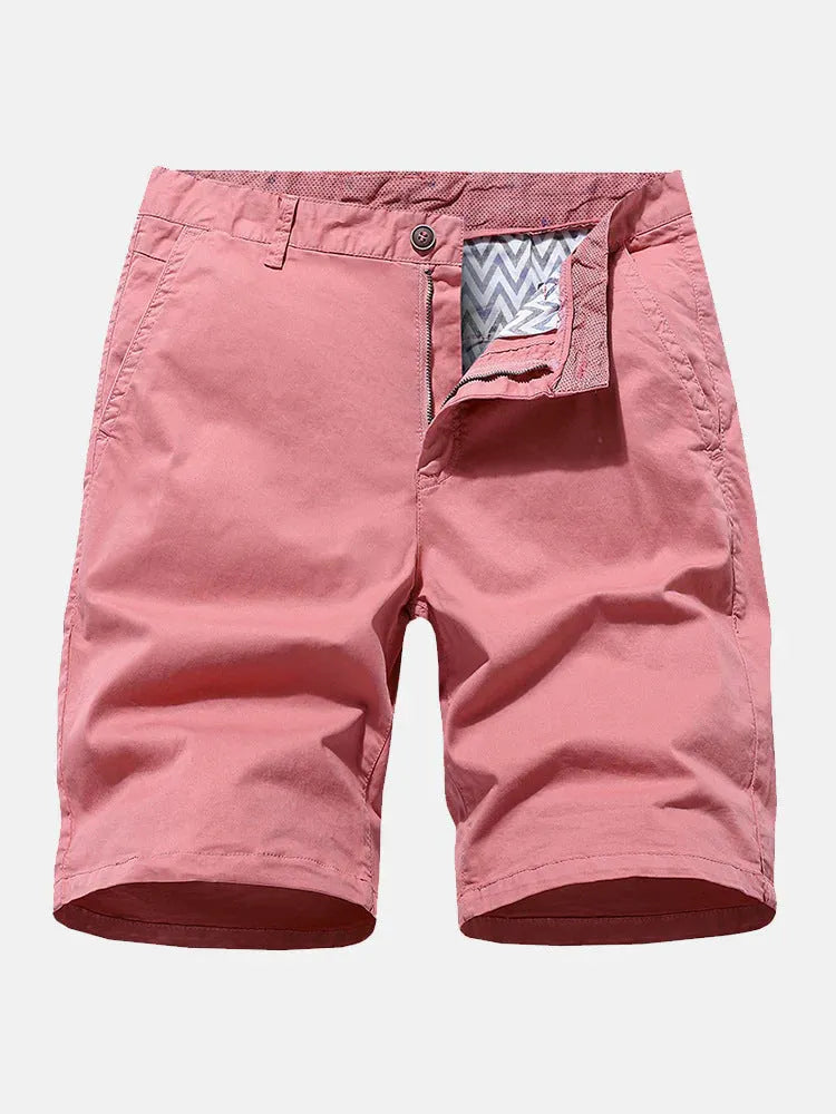 Man wearing loose-fit blue denim casual shorts with no belt, showcasing straight leg design.