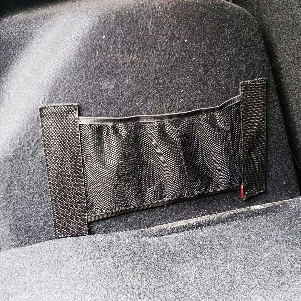 Elasticated polyester car boot storage net shown holding shopping bags, available in 20x35cm and 20x45cm sizes.