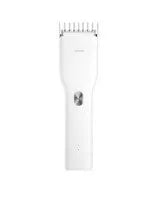 Black and white cordless electric hair clippers with adjustable comb on a stand