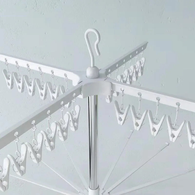 Stainless steel mobile drying rack with three layers and plastic clip sections for organised clothes drying