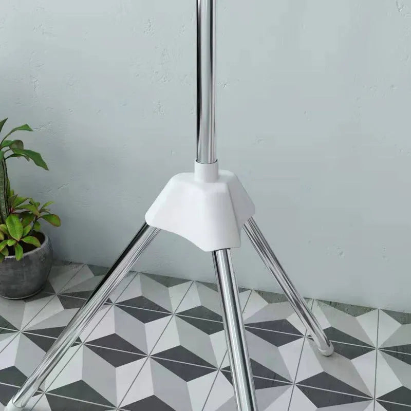 Stainless steel mobile drying rack with three layers and plastic clip sections for organised clothes drying