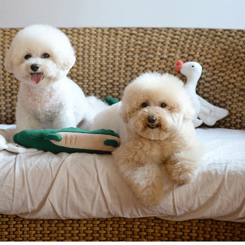 Green plush toy dog measuring 35cm long by 18cm wide
