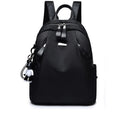 Medium-sized wine red Oxford cloth rucksack with double straps and a soft handle.