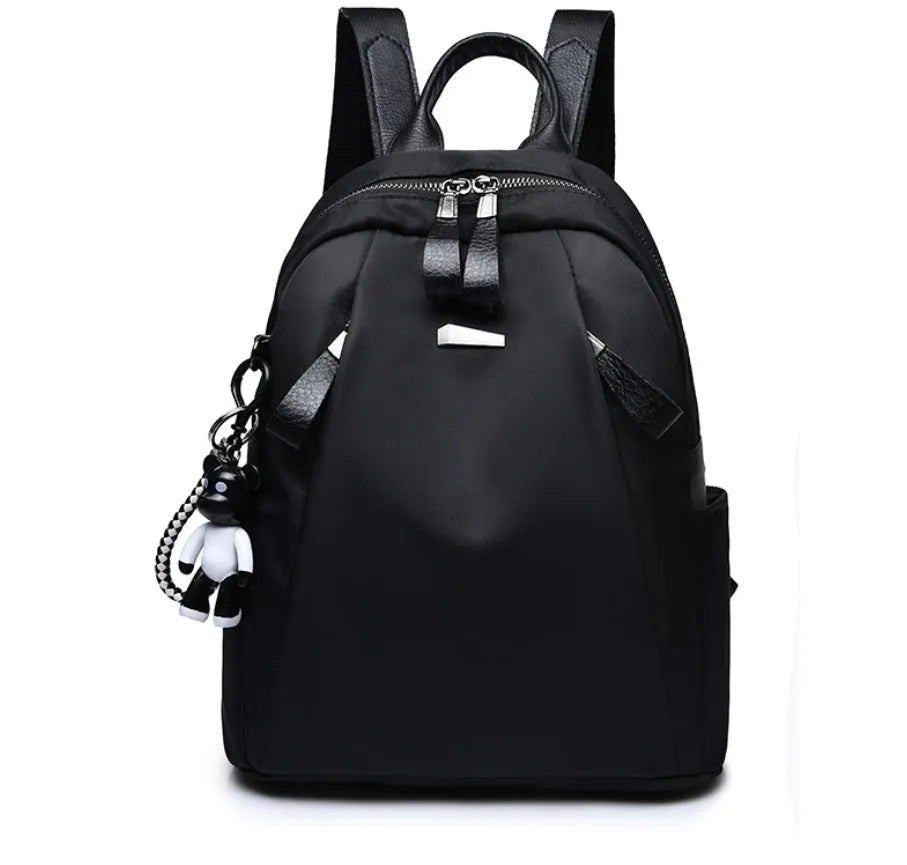 Medium-sized wine red Oxford cloth rucksack with double straps and a soft handle.